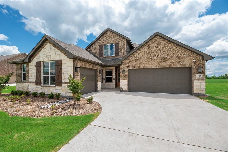 Front exterior of a new home in Fannin Ranch, Leonard, TX, highlighting curb appeal (Image 20). Front exterior of a new home in Fannin Ranch, Leonard, TX, highlighting curb appeal (Image 20).