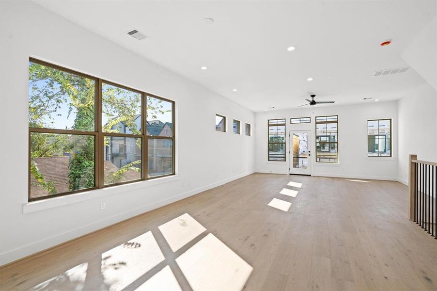 View from kitchen to front terrace.Previous home by builder. Finishes may vary.