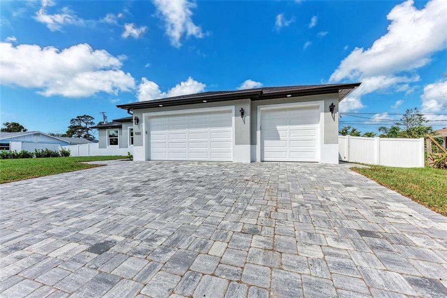 Front exterior of a new home in , Venice, FL, highlighting curb appeal (Image 21).