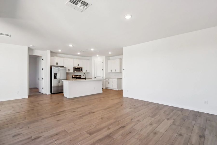 Great room and kitchen. Not actual home, finishes may vary by community. Great room and kitchen. Not actual home, finishes may vary by community.