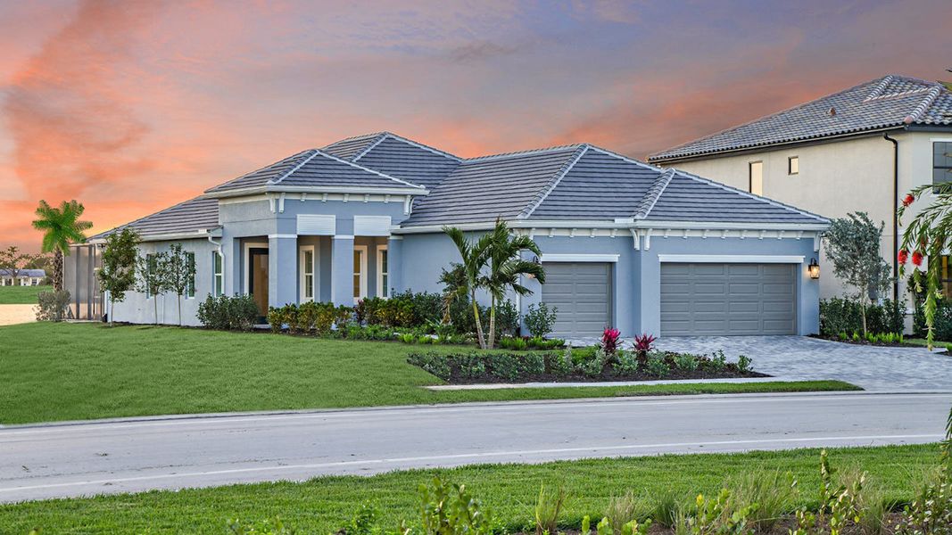 Front exterior of a new home in SkySail Real Estate and Homes for Sale in Naples, FL - Neal Communities, Naples, FL, highlighting curb appeal (Image 21). Front exterior of a new home in SkySail Real Estate and Homes for Sale in Naples, FL - Neal Communities, Naples, FL, highlighting curb appeal (Image 21).