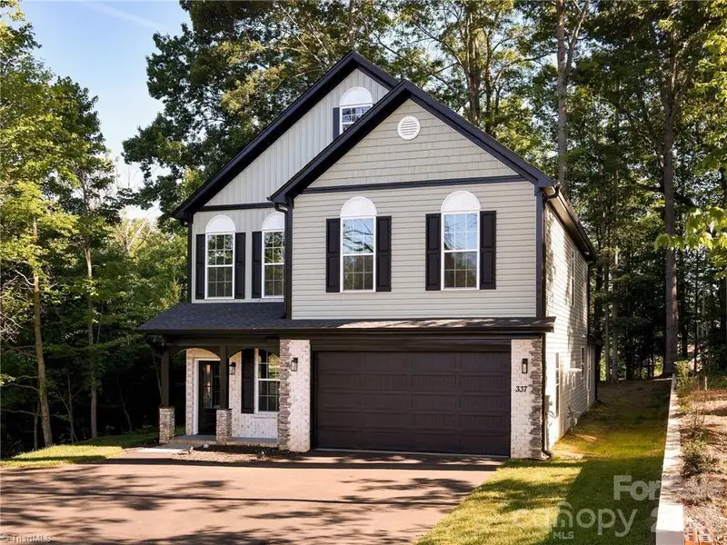 Front exterior of a new home in , Winston-Salem, NC, highlighting curb appeal (Image 1). Front exterior of a new home in , Winston-Salem, NC, highlighting curb appeal (Image 1).