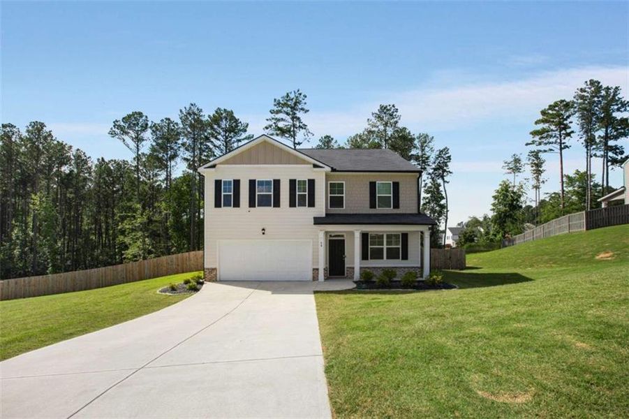 Front exterior of a new home in Stillwater Springs, Dacula, GA, highlighting curb appeal (Image 27). Front exterior of a new home in Stillwater Springs, Dacula, GA, highlighting curb appeal (Image 27).
