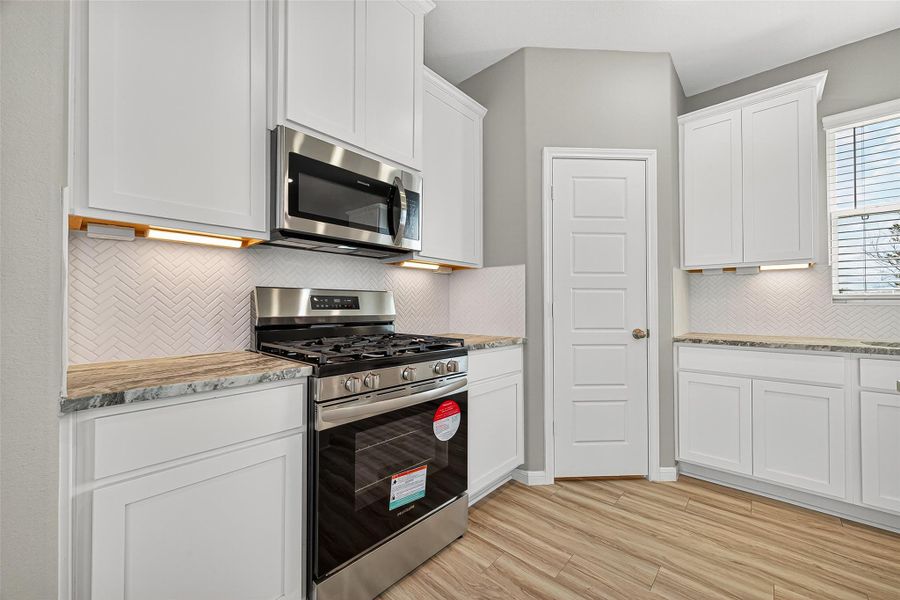 Furnished interior view inside a new home in Sunterra, Katy (Image 10).