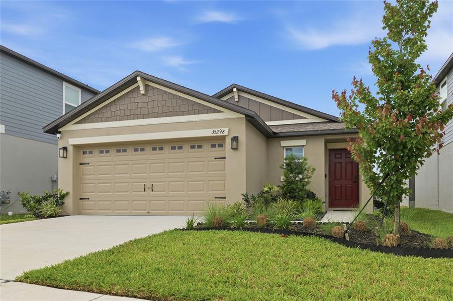 Front exterior of a new home in , Zephyrhills, FL, highlighting curb appeal (Image 22).
