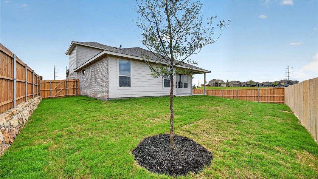 Exterior details and patio area of a home in Bluestem, Rhome (Image 2). Exterior details and patio area of a home in Bluestem, Rhome (Image 2).