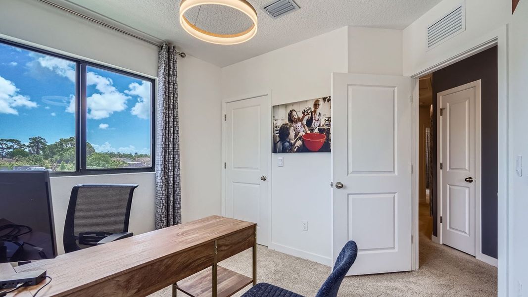 Representative furnished interior of a home built from the Topaz by D.R. Horton in Ashwood Cove, Lake Worth (Image 27).