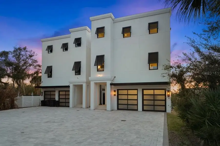 Front exterior of a new home in , New Smyrna Beach, FL, highlighting curb appeal (Image 26).