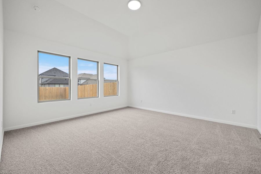 Primary Bedroom in the Quartz home plan by Trophy Signature Homes – REPRESENTATIVE PHOTO