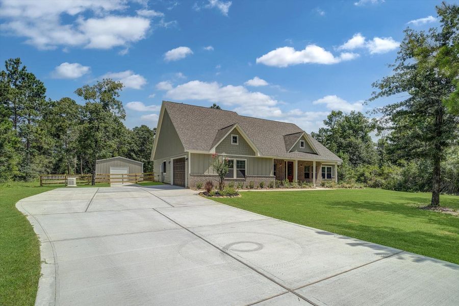 Front exterior of a new home in , New Waverly, TX, highlighting curb appeal (Image 1). Front exterior of a new home in , New Waverly, TX, highlighting curb appeal (Image 1).