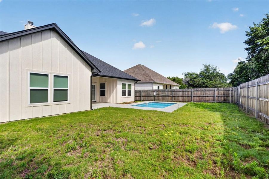 Side view overlooking the pool and covered back porch.
