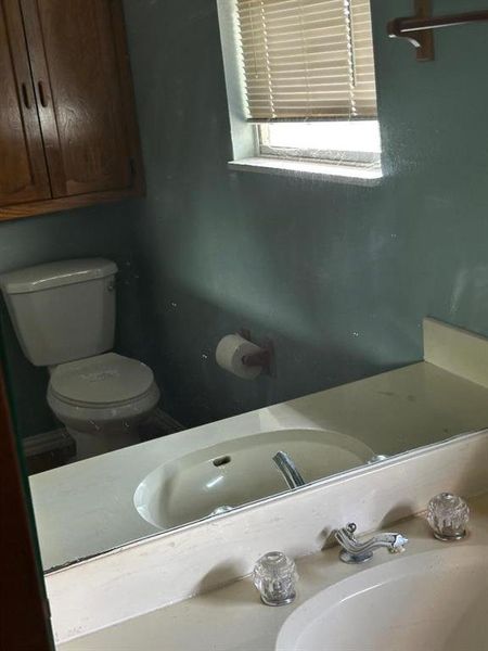 Half bath with toilet and a sink