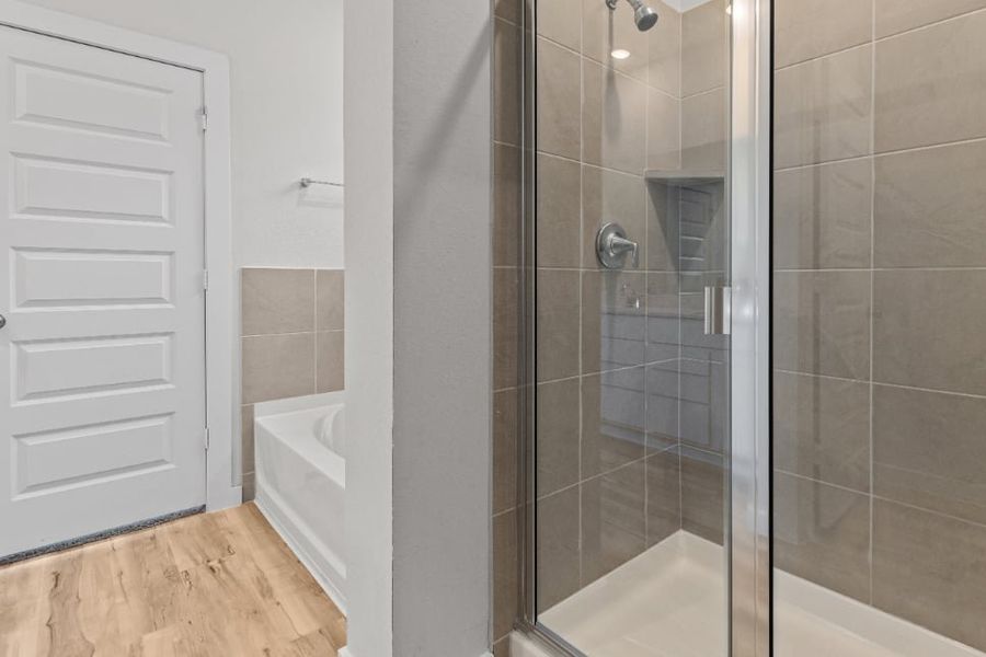 A shower with a glass door. A shower with a glass door.
