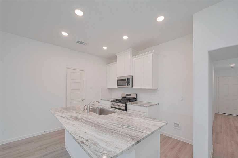 Furnished interior view inside a new home in Sunterra, Katy (Image 7).