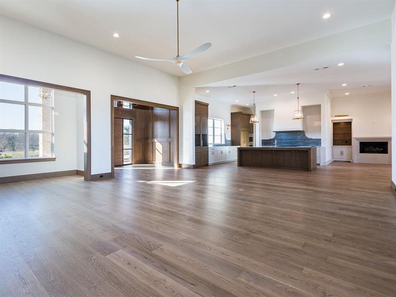 Open floor plan with paneled front entry and keeping room next to kitchen.