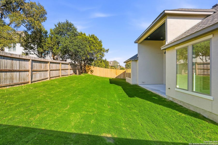 Exterior details and patio area of a home in Kinder Ranch 70's, San Antonio (Image 3).