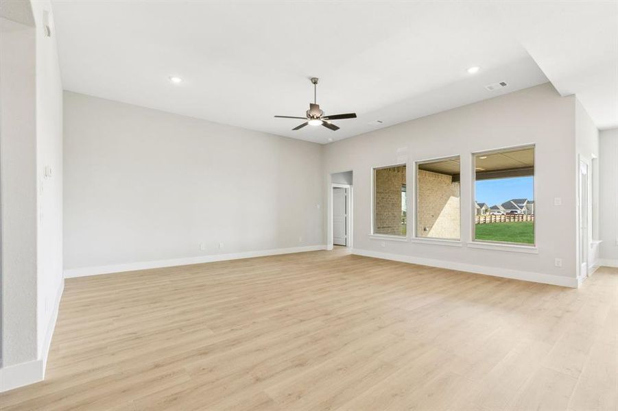 Unfurnished room featuring light wood-style flooring and ceiling fan Unfurnished room featuring light wood-style flooring and ceiling fan