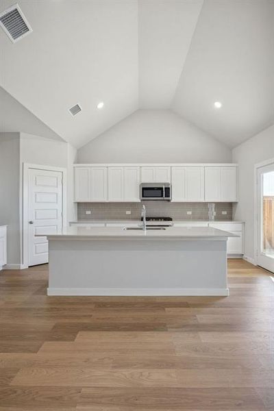 Kitchen in the Wimbledon home plan by Trophy Signature Homes – REPRESENTATIVE PHOTO Kitchen in the Wimbledon home plan by Trophy Signature Homes – REPRESENTATIVE PHOTO