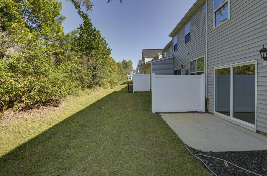 Exterior details and patio area of a home in Kensington Place Townhomes, Lexington (Image 4).