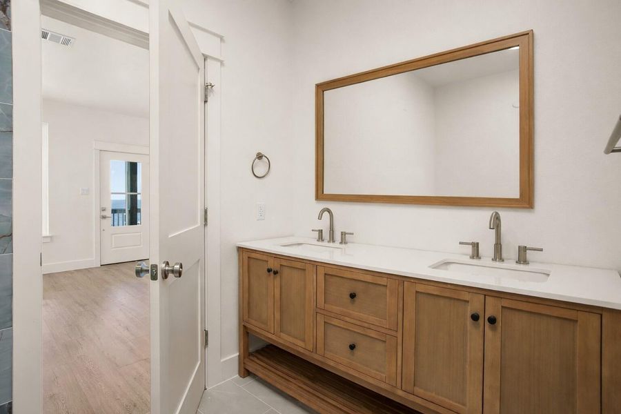 En suite bathroom with double vanity (mirror virtually added)