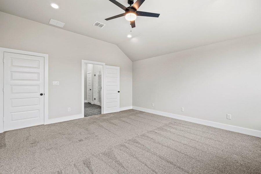 Unfurnished bedroom with vaulted ceiling, recessed lighting, baseboards, carpet flooring, and ceiling fan Unfurnished bedroom with vaulted ceiling, recessed lighting, baseboards, carpet flooring, and ceiling fan