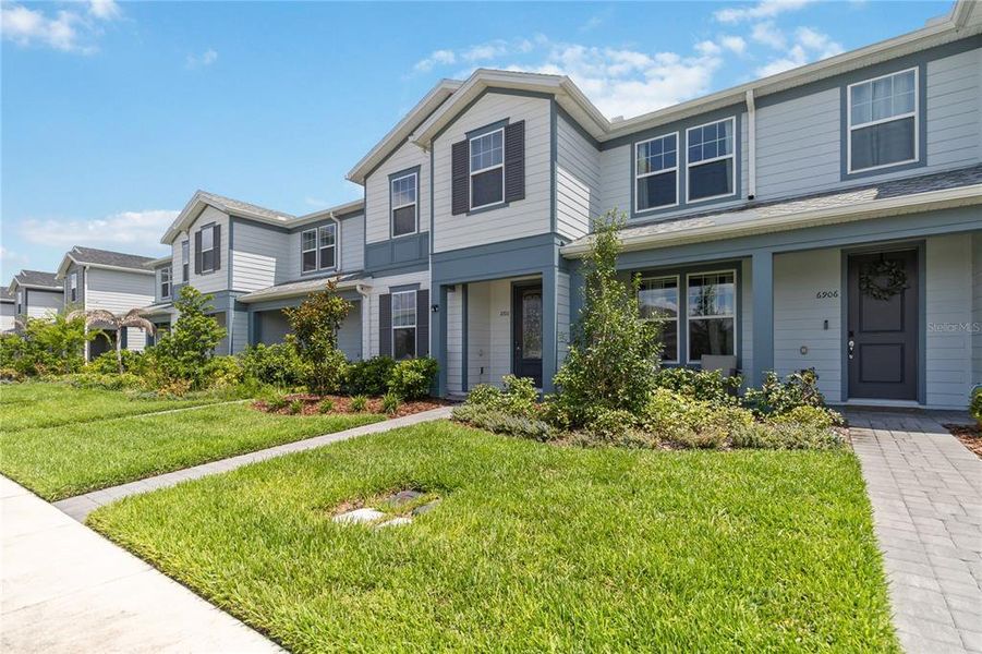 Front exterior of a new home in , Orlando, FL, highlighting curb appeal (Image 25). Front exterior of a new home in , Orlando, FL, highlighting curb appeal (Image 25).