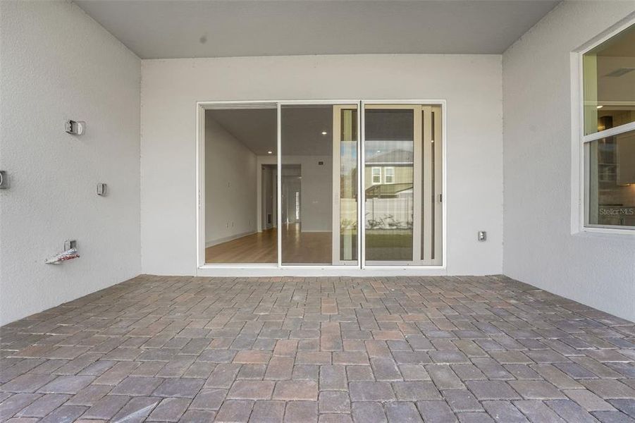 Exterior details and patio area of a home in Palms at Windermere, Windermere (Image 25).