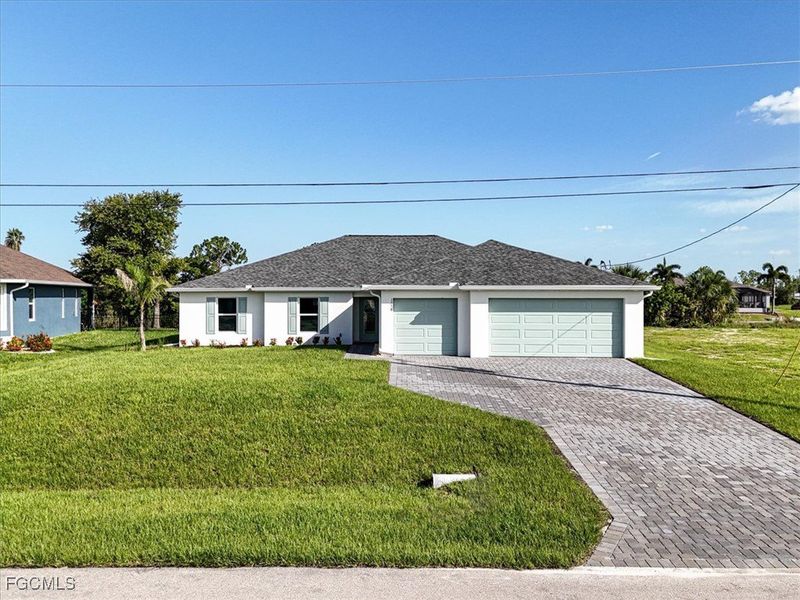 Front exterior of a new home in Cape Coral, Cape Coral, FL, highlighting curb appeal (Image 21).