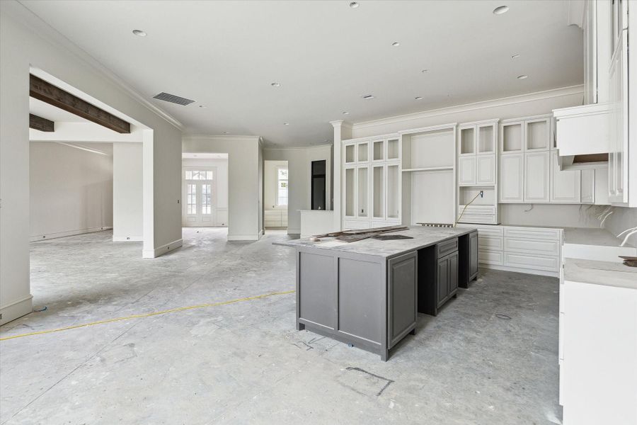Progress photo from December 2025 - Kitchen opens up to adjacent rooms with ample space to entertain