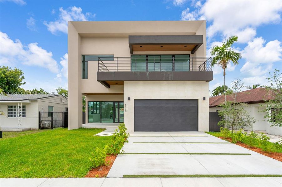 Front exterior of a new home in , Miami, FL, highlighting curb appeal (Image 1). Front exterior of a new home in , Miami, FL, highlighting curb appeal (Image 1).