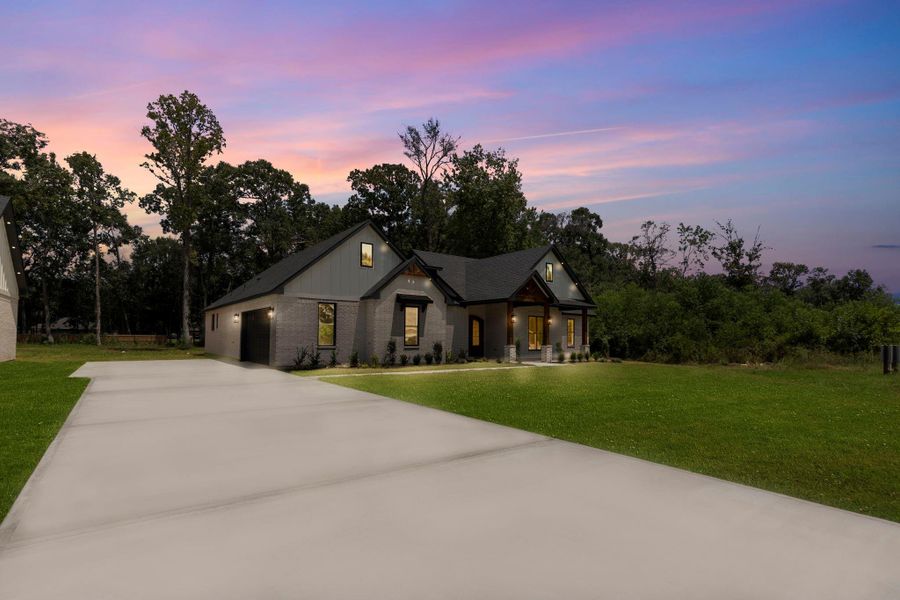 Front exterior of a new home in , Dayton, TX, highlighting curb appeal (Image 23).