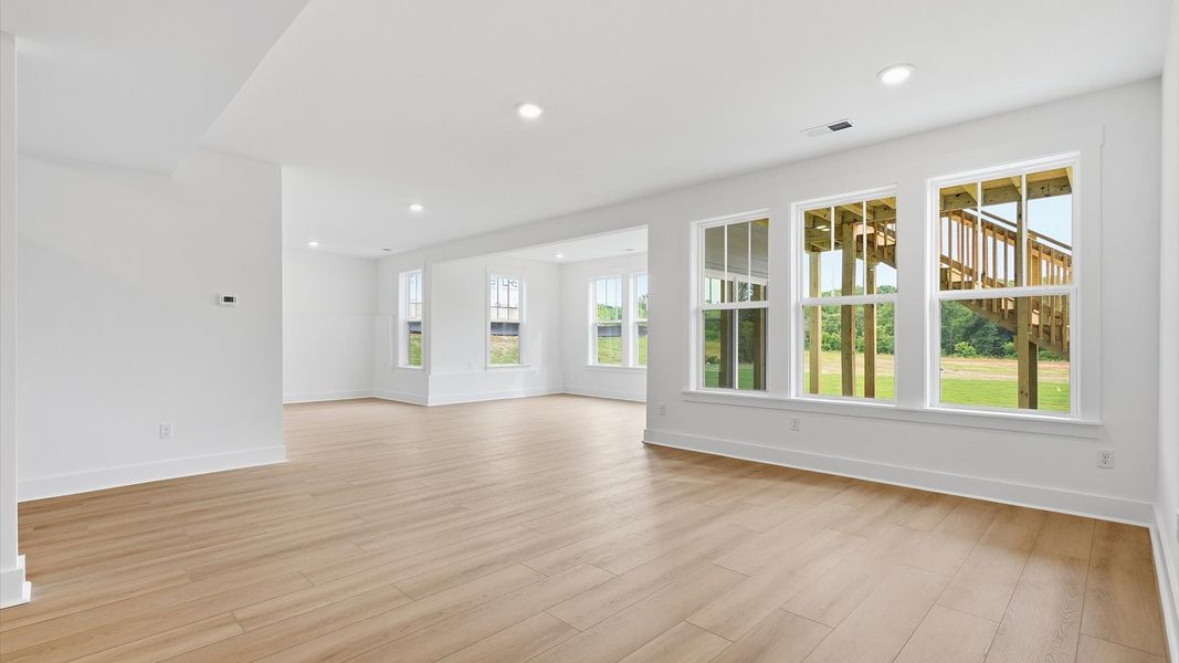 Spacious lower-level living room offering versatile space for entertainment and everyday comfort