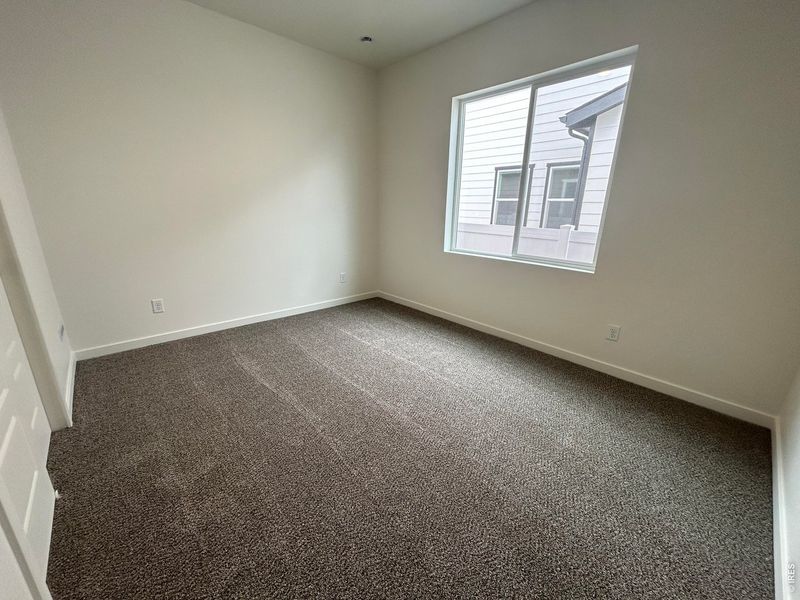 Spacious, unfurnished interior of a new home in Union Colony West, Greeley (Image 9).