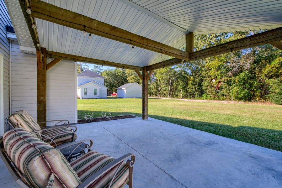 Exterior details and patio area of a home in , Bonneau (Image 3).