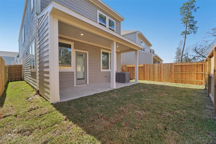 Exterior details and patio area of a home in Pinewood Trails - City Series, Atascocita (Image 22).
