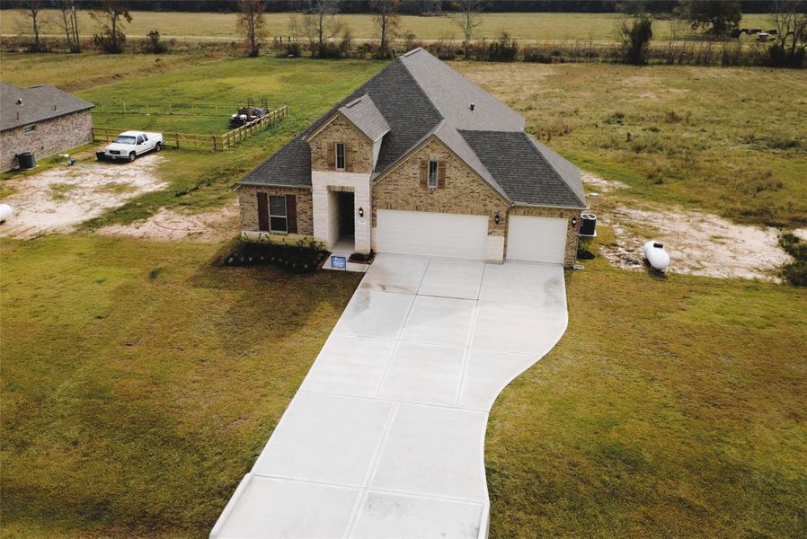 Front exterior of a new home in , Cleveland, TX, highlighting curb appeal (Image 24).