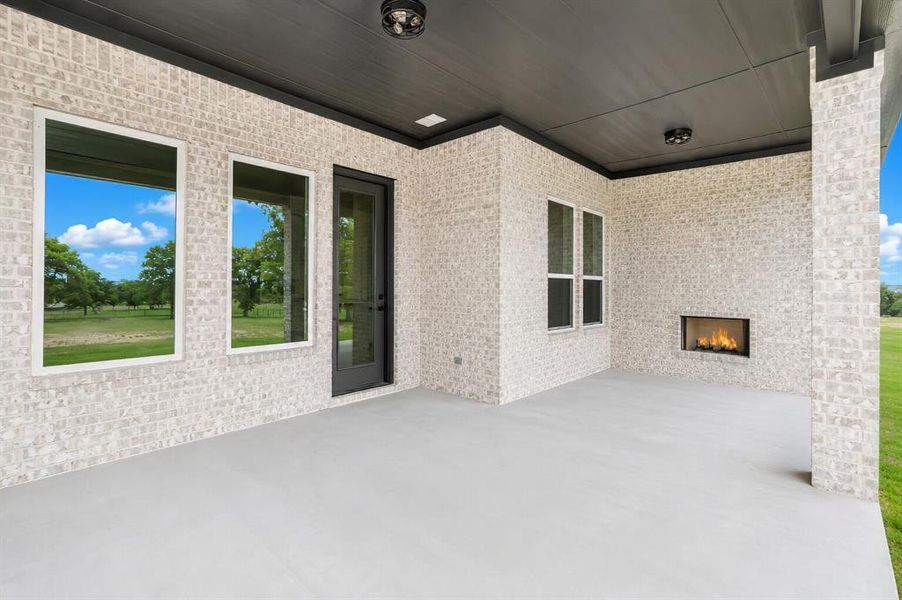 Exterior details and patio area of a home in , Poolville (Image 4).