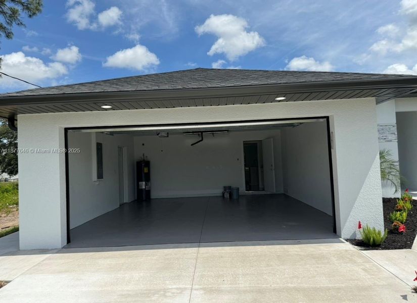 Front exterior of a new home in , Lehigh Acres, FL, highlighting curb appeal (Image 2).