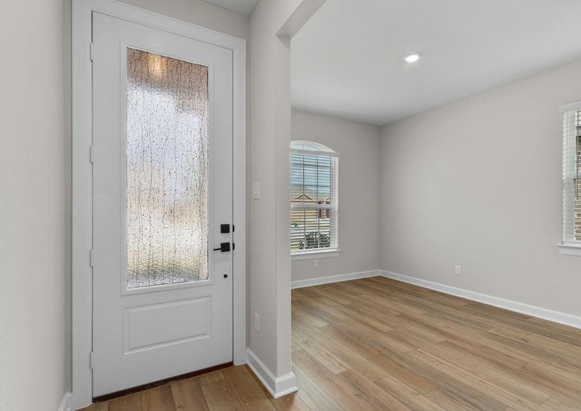 The entryway is highlighted by this gorgeous 3/4 lite door!