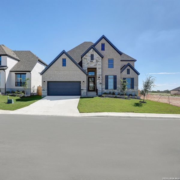 Front exterior of a new home in Ladera, San Antonio, TX, highlighting curb appeal (Image 21).