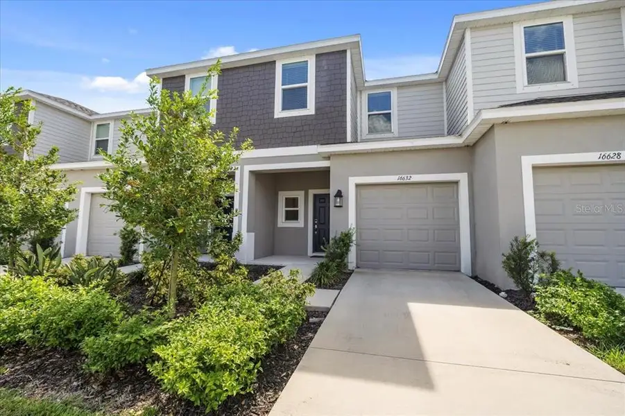 Front exterior of a home in the The Townhomes at Azario Lakewood Ranch community, located in Bradenton, FL (Image 2).