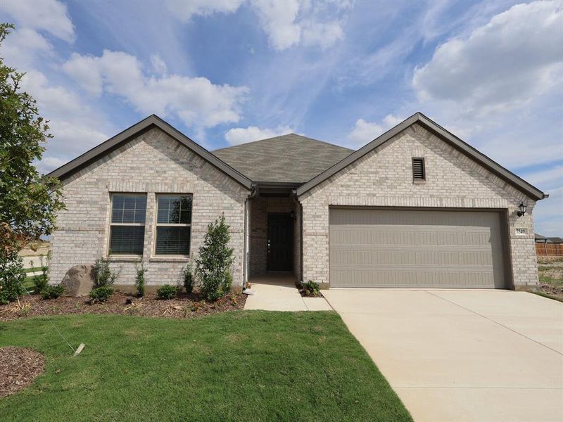 Front exterior of a new home in Meadow Park, Denton, TX, highlighting curb appeal (Image 1).