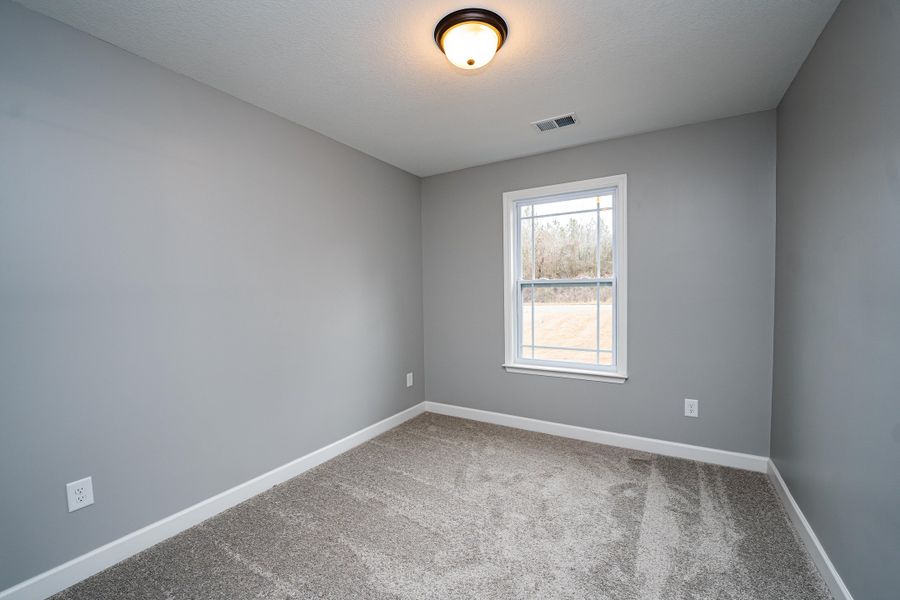 Representative unfurnished interior of a home built from the Saxon by Enchanted Homes in Guadalupe Heights, Seguin (Image 41).