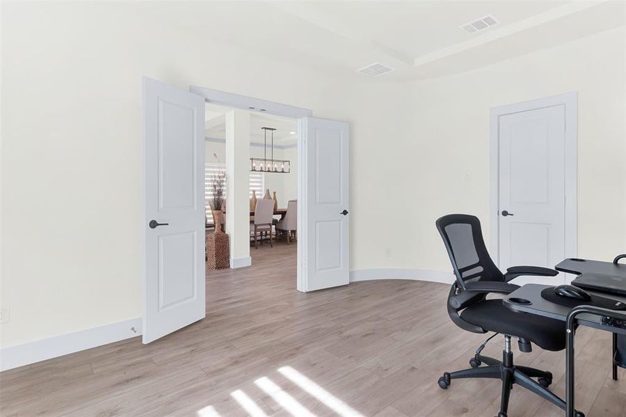 Office featuring light wood finished floors and baseboards Office featuring light wood finished floors and baseboards