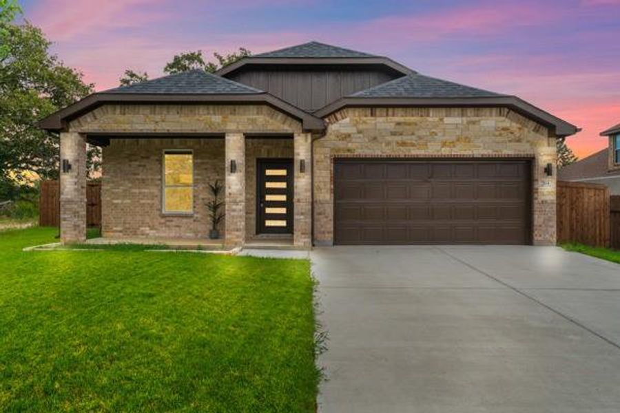 View of front of property with covered porch, concrete driveway, an attached garage, and brick siding View of front of property with covered porch, concrete driveway, an attached garage, and brick siding