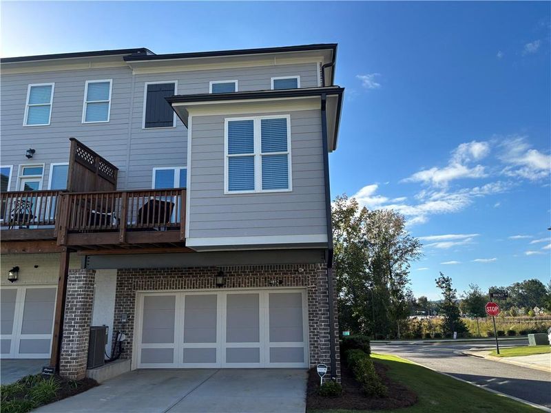 Exterior details and patio area of a home in Brackley Townhomes, Cumming (Image 24). Exterior details and patio area of a home in Brackley Townhomes, Cumming (Image 24).