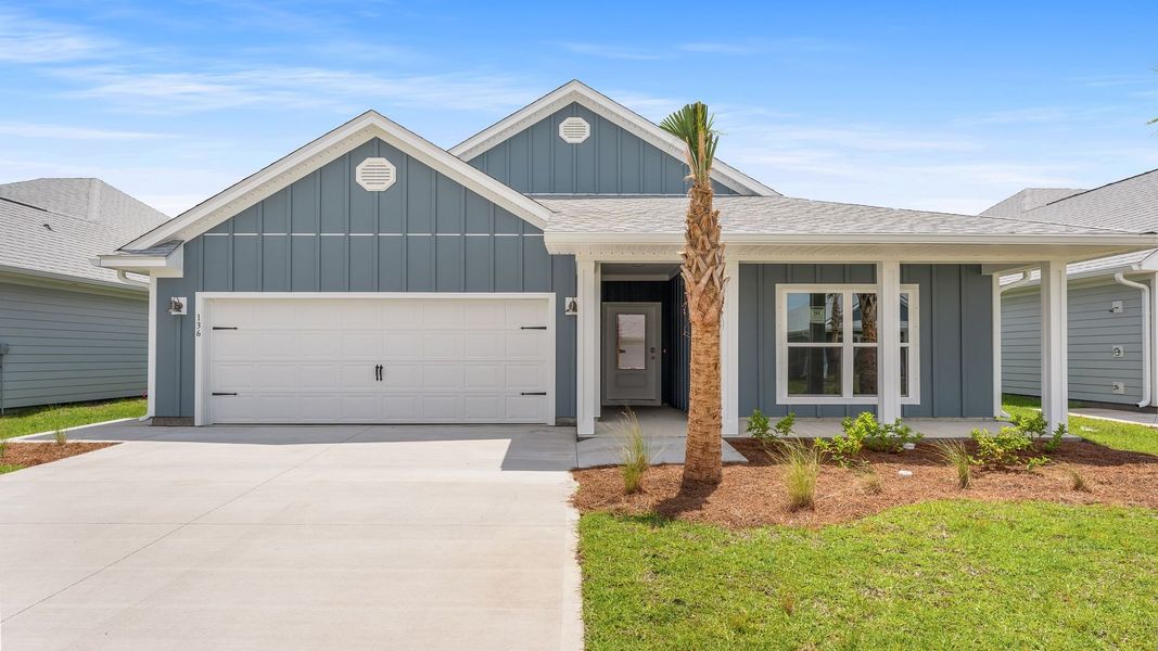 Front exterior of a new home in WindMark Beach, Port Saint Joe, FL, highlighting curb appeal (Image 1). Front exterior of a new home in WindMark Beach, Port Saint Joe, FL, highlighting curb appeal (Image 1).
