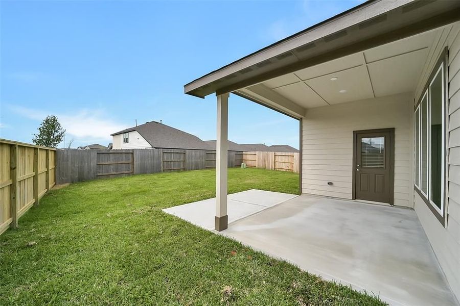 Front exterior of a new home in Sunterra, Katy, TX, highlighting curb appeal (Image 52).