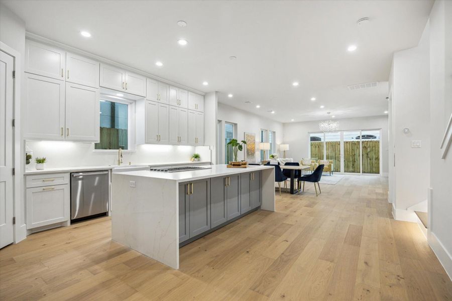 Kitchen - is located on the first floor. It has waterfall edge quartz island. Kitchen - is located on the first floor. It has waterfall edge quartz island.