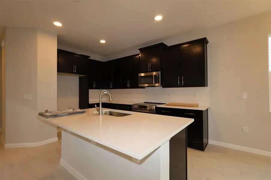 Furnished interior view inside a new home in Emerson Pointe, Apopka (Image 5).